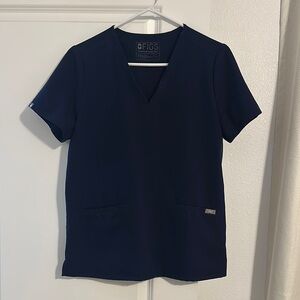Figs scrub shirt with pockets.